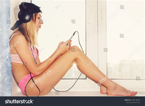 Naked Woman Listening Music On Window Stock Photo Shutterstock