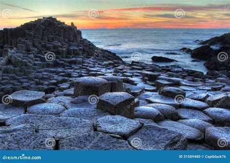 Giant s Causeway at sunset stock photo. Image of stone - 31589480