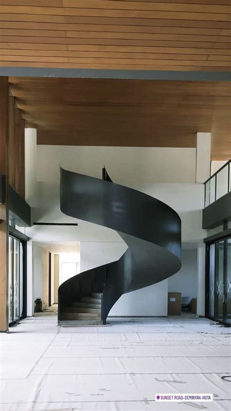 A Large Spiral Staircase In An Empty Building