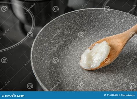 Wooden Spoon with Coconut Oil in Frying Pan Stock Photo - Image of ...