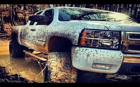 Jacked Up Chevy Trucks Mudding