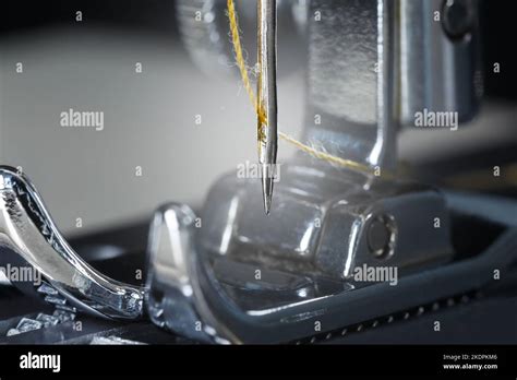 Yellow Thread Needle And Sewing Machine Foot Macro Photography Stock