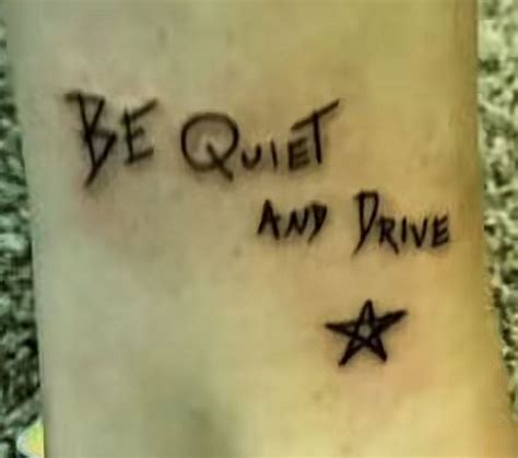 A Tattoo Saying Be Quiet And Drive With Stars On It