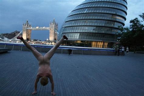 An Exhibitionist Traveler Takes A Naked Photo Against The Backdrop Of