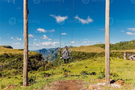 Woman Ride On A Swing In Espraiado Canyon Park In Urubici Santa