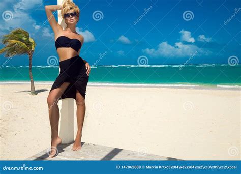 Beautiful Woman In Bikini Posing On The Caribbean Beach Stock Photo Image Of Stunning Luxury