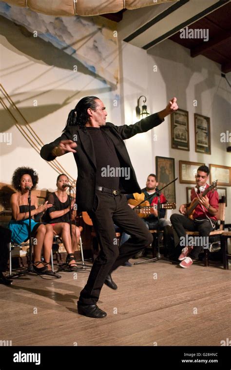 A Male Flamenco Dancer Performing In A Restaurant In The Old Town Of