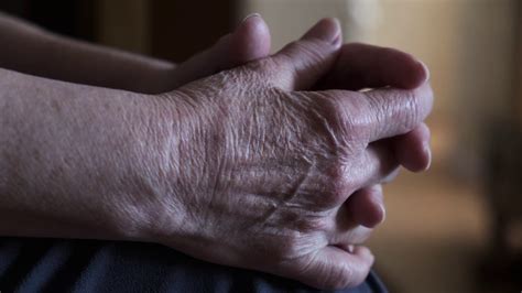 Wrinkled Hands Of An Old Woman Closeup The Parched Skin Of The Old