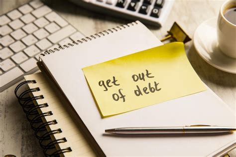 Premium Photo Get Out Of Debt Is Written On Paper