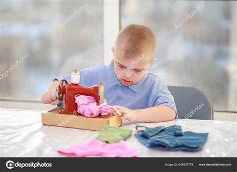 Boy Down's Syndrome Sews Clothes Dolls Disabled Child Type Trisonomy ...