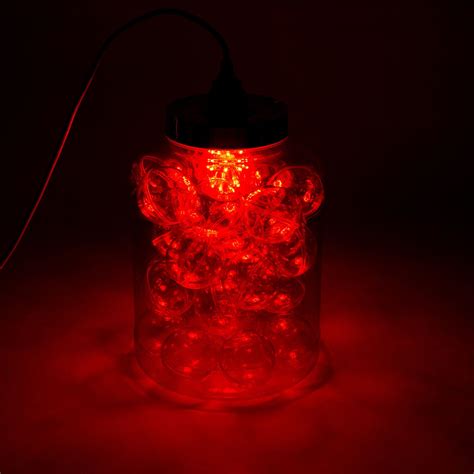 Container From Red Plastic Filled With Plexiglas Balls The Bulb Has