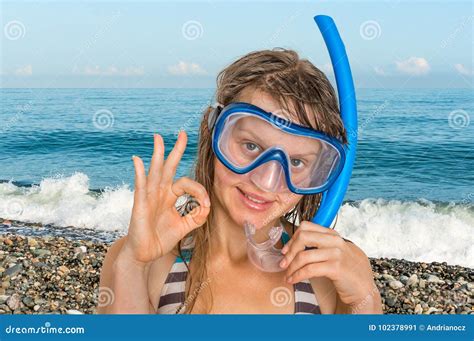 Woman With Snorkeling Mask For Diving Stands Near The Sea Stock Image