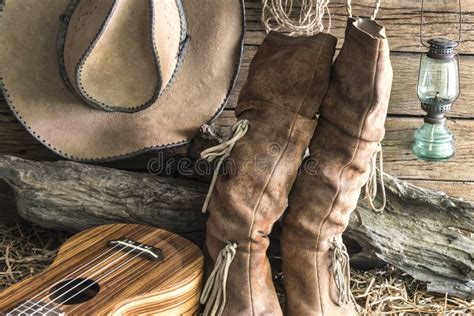 American West Rodeo Cowboy Hat And Boots In A Barn Stock Photo Image