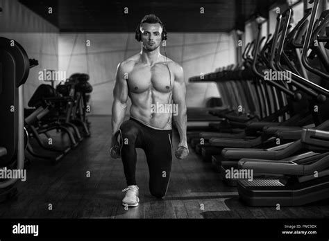 Young Man Working Out Legs With Dumbbells One Of The Best