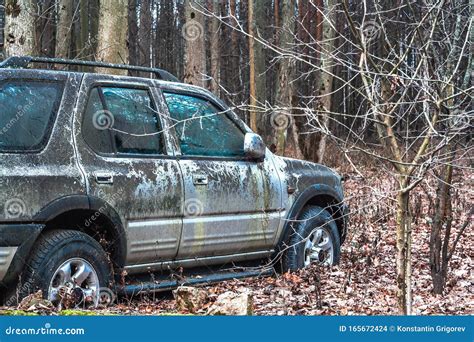 Old Forgotten Out Scrap Car That Has Been Abandoned In The Woods