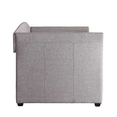 A Gray Couch With Two Pillows On The Back And One Arm Facing Away From