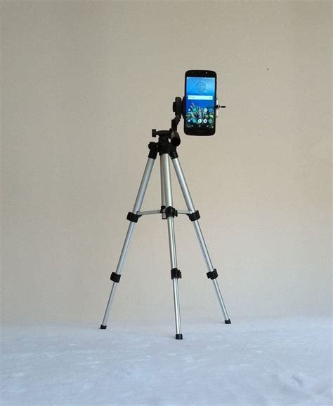 A Tripod With A Cell Phone Attached To It