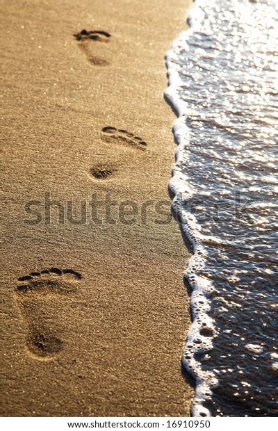 Footprints On Beach Sand Sunset Vertical Stock Photo (Edit Now) 16910950