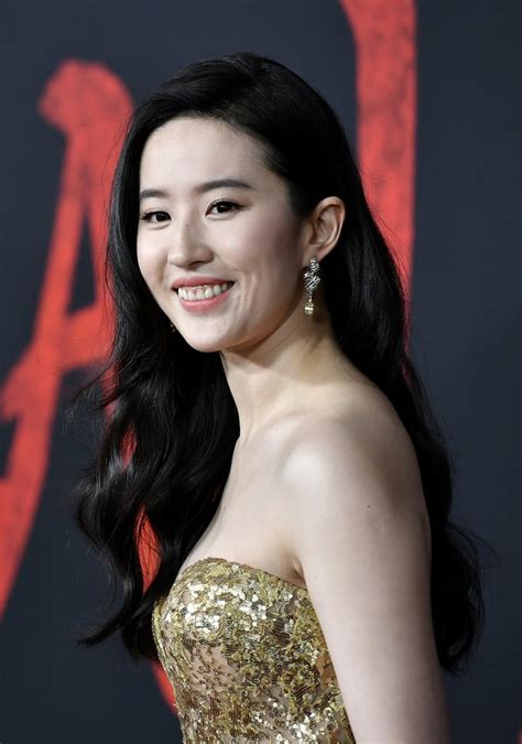 Liu Yifei Wearing Gold Elie Saab Gown At Mulan Premiere Popsugar Fashion