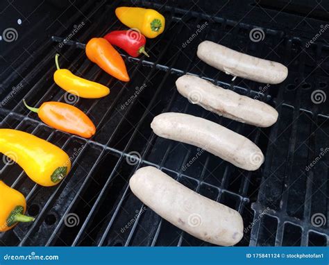 Sausages And Colorful Peppers On Barbecue Grill Stock Photo Image Of