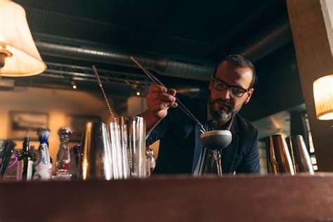 Premium Photo Expert Barman Is Making Cocktail At Night Club