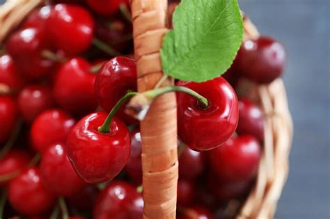 Premium Photo Wicker Basket With Fresh Ripe Cherries Close Up