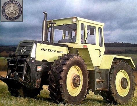 A Yellow Tractor Parked On Top Of A Lush Green Field