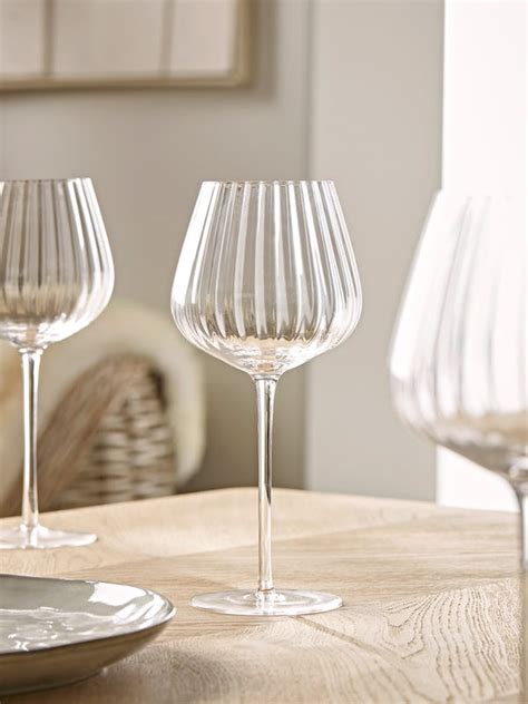 Four Ribbed Wine Glasses