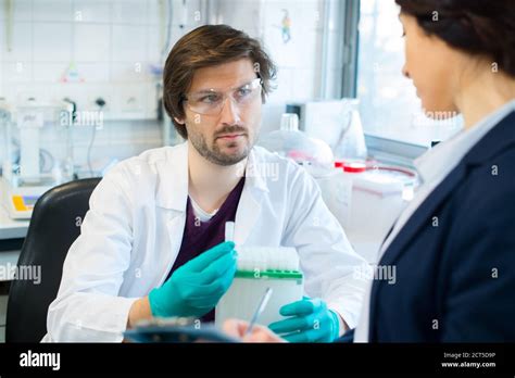 Lab Worker In Uniform Testing New Substance Stock Photo Alamy