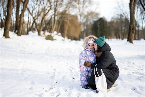 Mother And Child On A Sunny Frosty Winter Day In The Park Stock Image