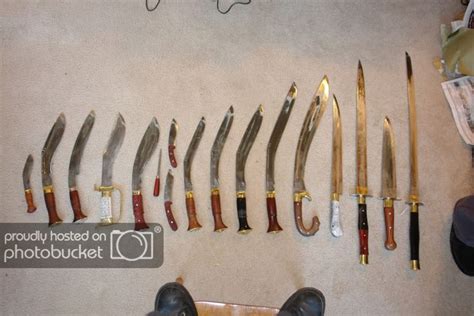 several knives are laid out on the floor next to a person's feet and shoes