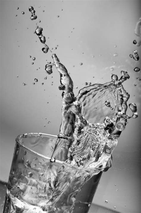 Fresh Water Splashing Out Of A Glass With Ice Stock Photo Image Of