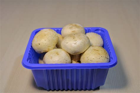 Fresh Mushrooms In Plastic Packaging On The Table Stock Image Image