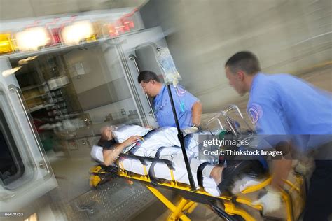 Paramedics Loading Patient Into Ambulance High Res Stock Photo Getty