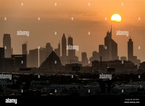 Dubai skyline at sunset Stock Photo - Alamy