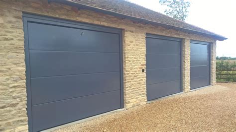 Trio Of Iso 45 Flush Sectional Garage Doors In RAL7015 Elite GD