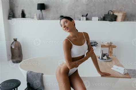 Attractive Woman In Lingerie Posing Near The Bath 11526040 Stock Photo At Vecteezy