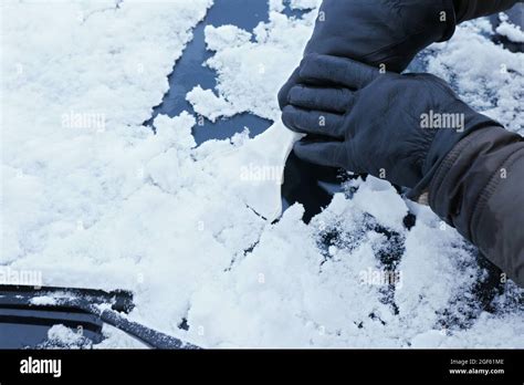 Removing Snow From Car Windshield Closeup Stock Photo Alamy