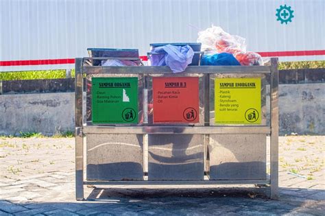 Three General Waste Bins Which Are Divided Into Three Categories Of