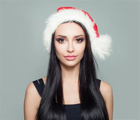 Premium Photo Beautiful Woman Brunette In Santa Hat Christmas Portrait