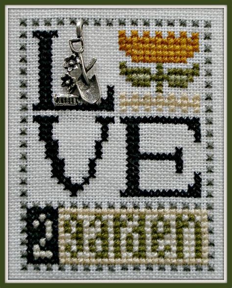 A Cross Stitch Pattern With The Words Love And Flowers In Black White