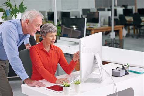 Computer Team And Mature Business People In Discussion Planning Or