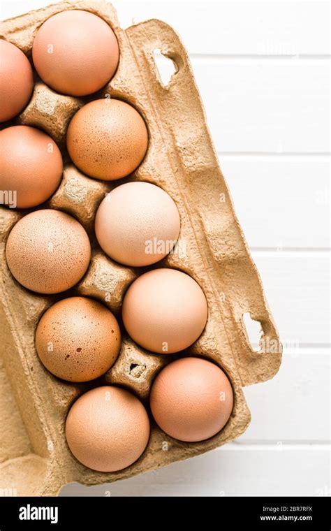 Raw Chicken Eggs In Egg Box Top View Stock Photo Alamy