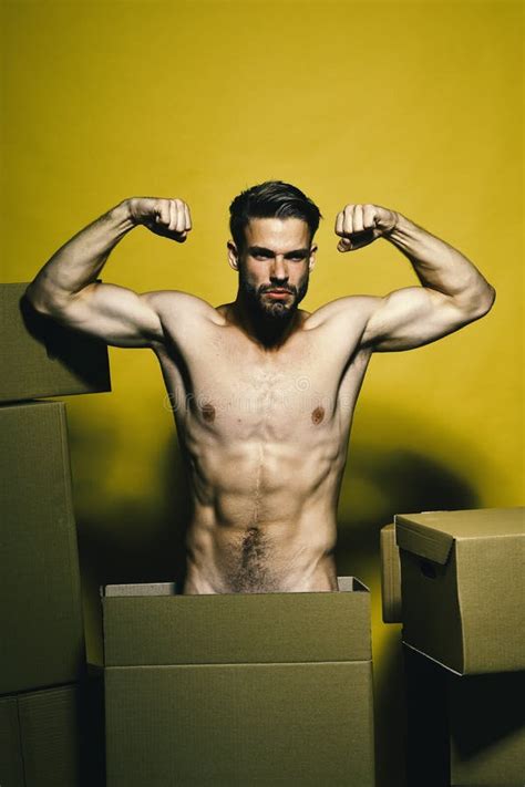Guy With Muscular Stands Naked Among Boxes Stock Photo Image Of Face