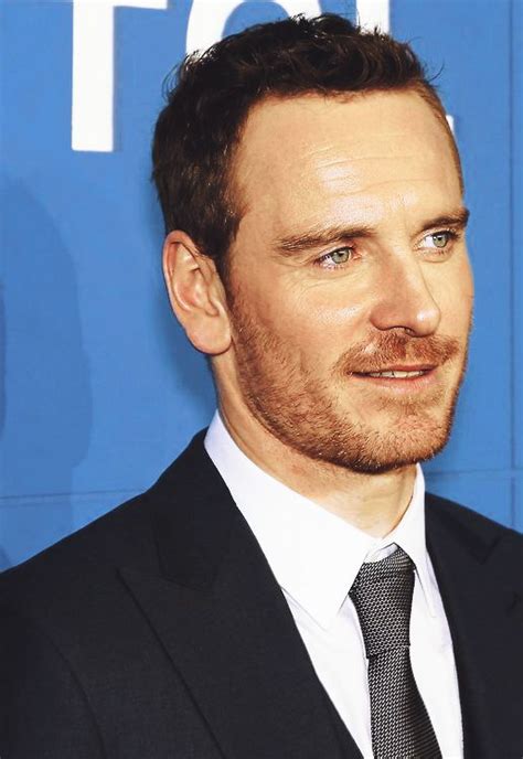 A Man In A Suit And Tie Posing For A Photo At The Tci Upfront