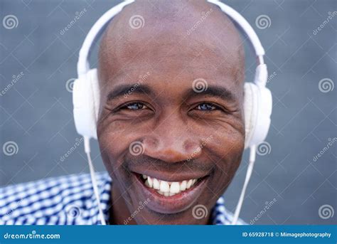 Smiling African American Man Listening To Music With Headphones Stock