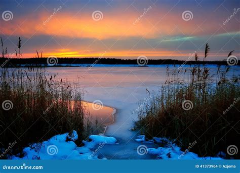 Winter Sunset on a Frozen Lake Stock Photo - Image of wonderland, lake ...