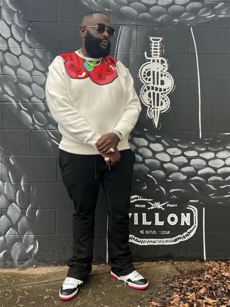 Rick Ross Wearing A White Floral Print Sweatshirt With Matching New