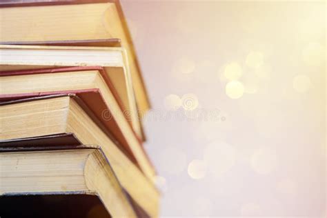 Stack Of Books Against Blue Sky Abstract Blurred Nature Scene Backdrop