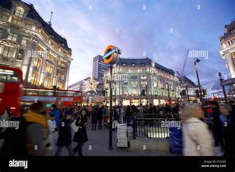 Busy Entrance To Oxford Circus Tube Station During Evening Rush Hour